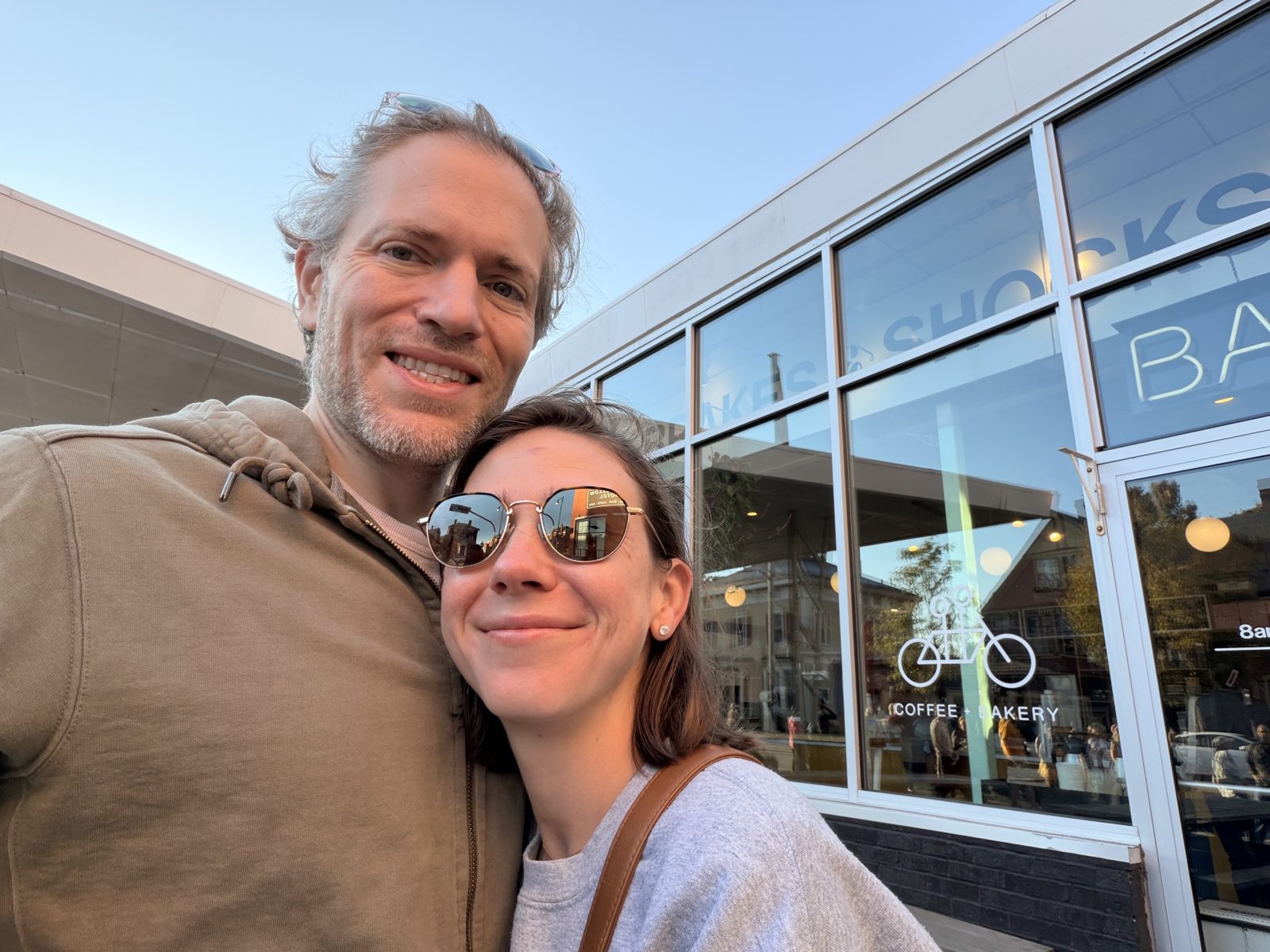 Haley and Michael in a selfie outside a coffee and bakery shop