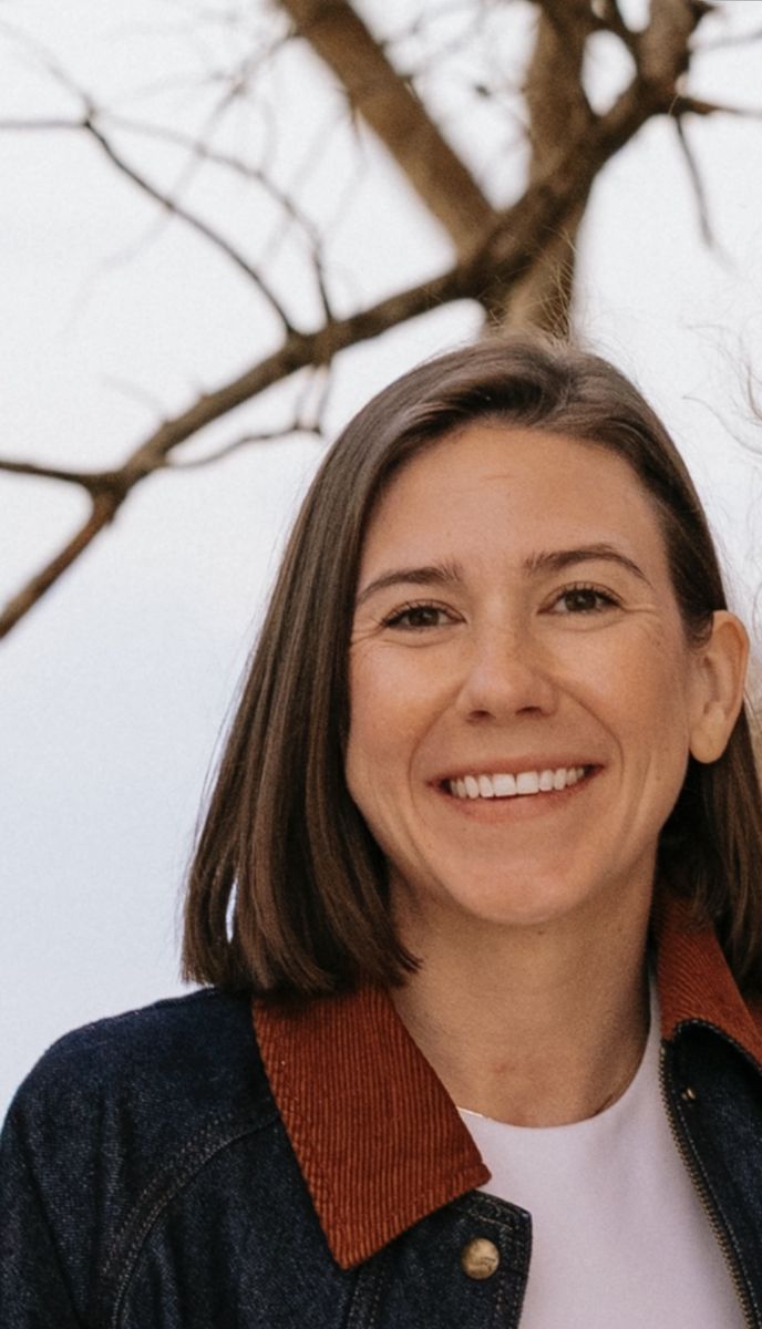 Haley, all smiles, in a denim jacket with a rust corduroy collar